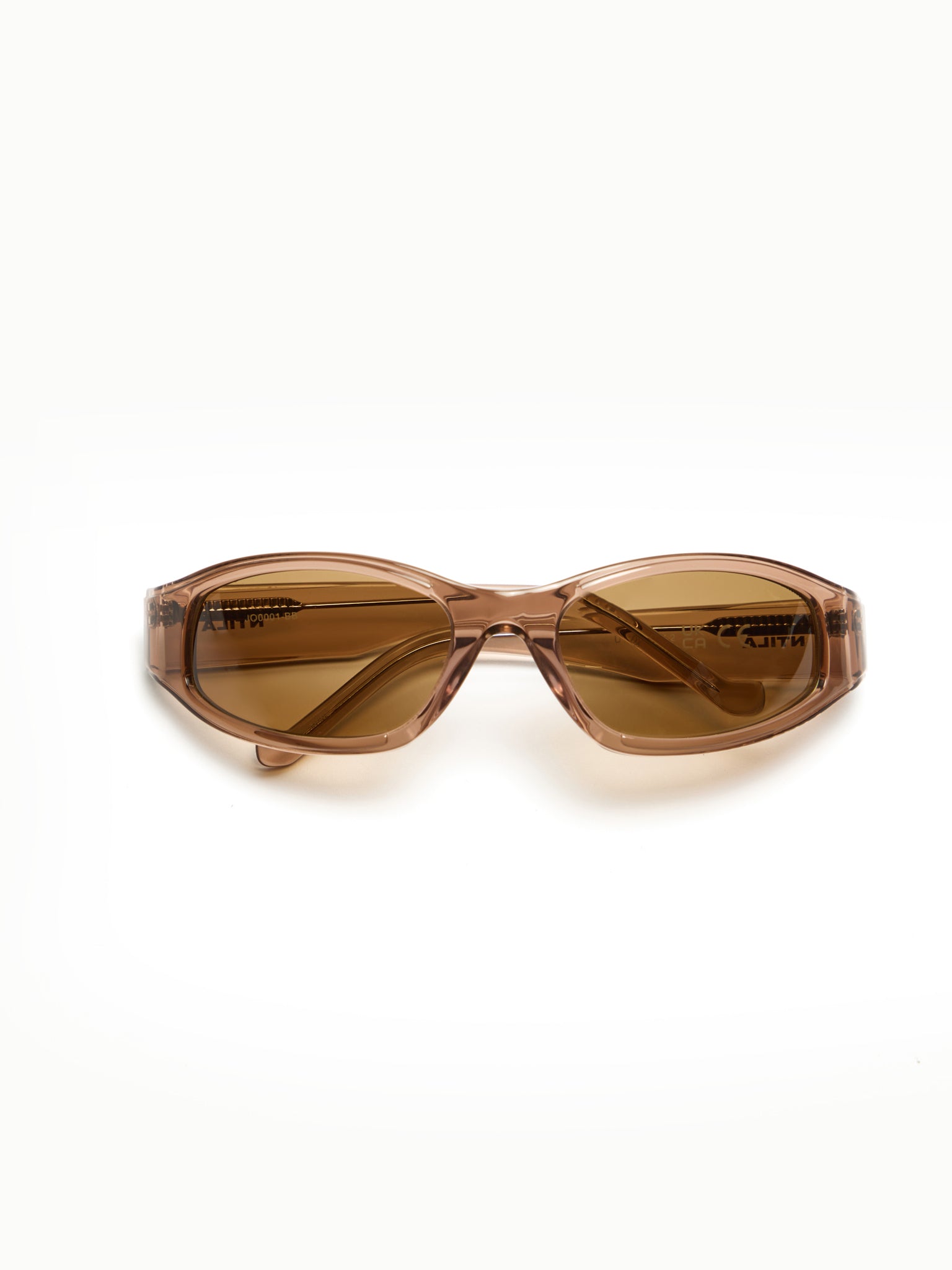 NTILA Ace brown toffee rose gold sunglasses with amber brown frame and dark lenses on a white background