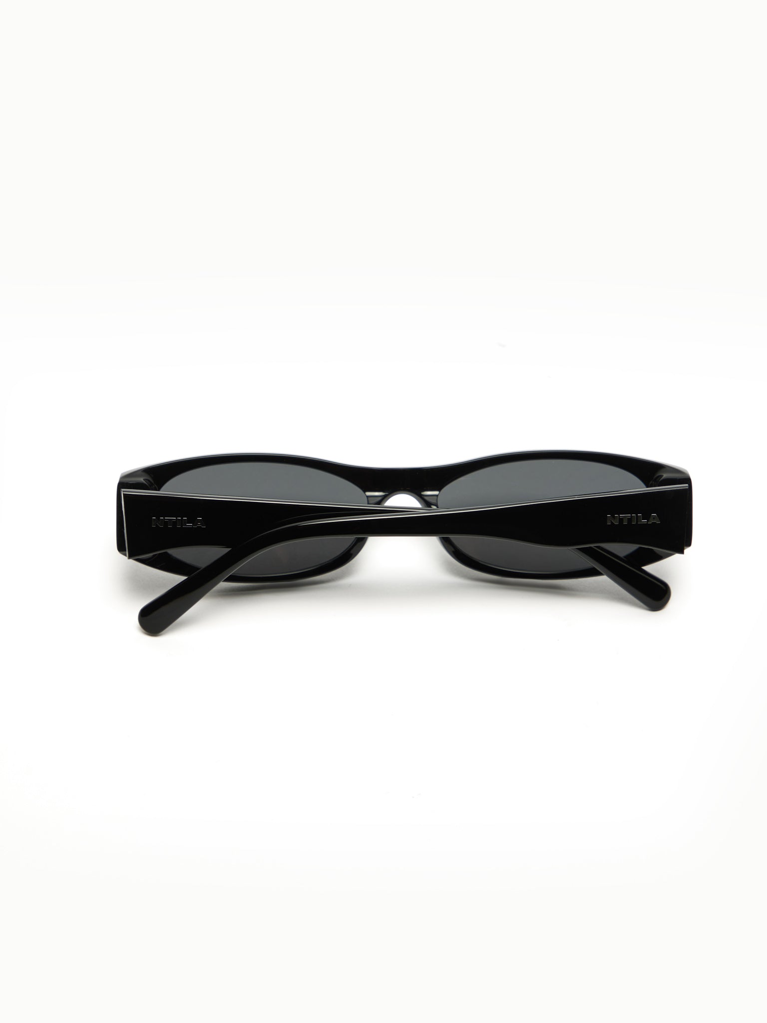 NTILA Leni black sunglasses on a white background