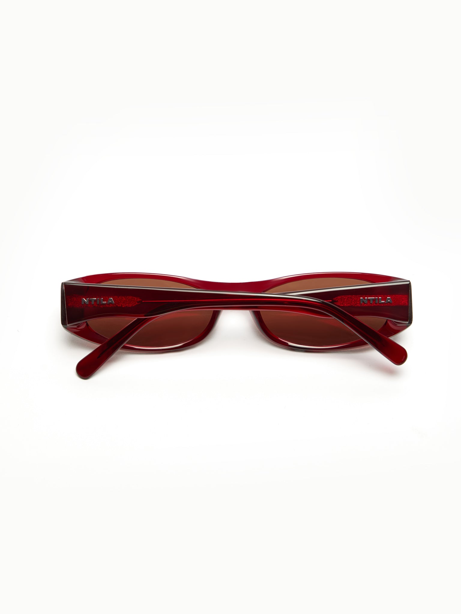 NTILA red wine Leni sunglasses on a white background