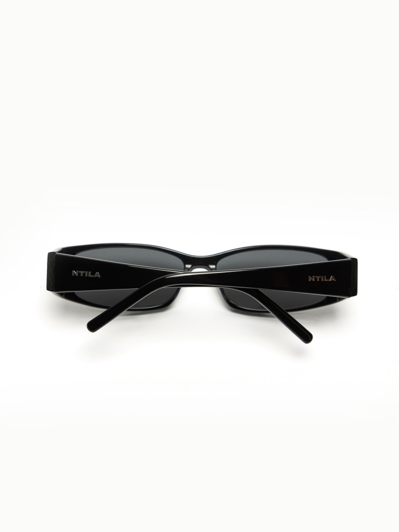 Roko black sunglasses with 'NTILA' branding on a white background